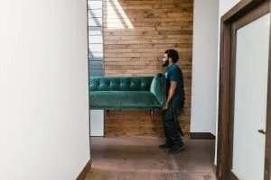 Movers moving a sofa