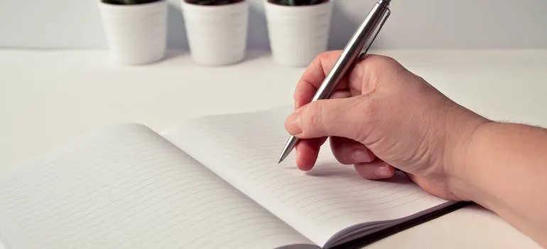 person writing about Prioritizing well-being during your move
