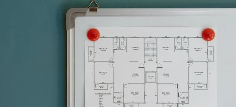 Floor plan hanging on whiteboard