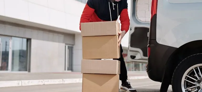 a man using boxes for safeguarding fragile items during a move