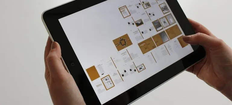 person holding a black ipad
