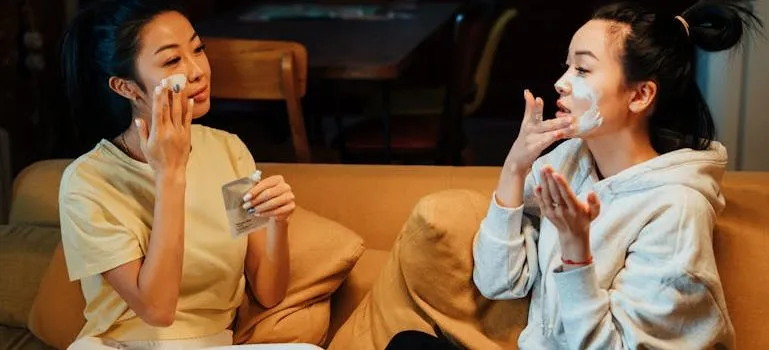 two girls doing skincare