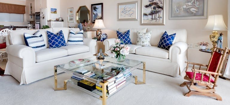 Square Glass Top Coffee Table and Two White Leather 2-seat Sofas