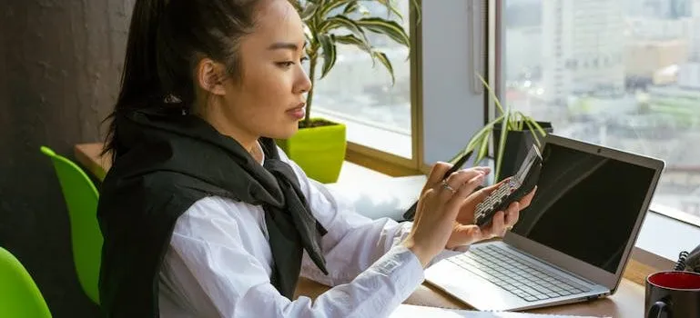 A Woman Computing with a Calculator