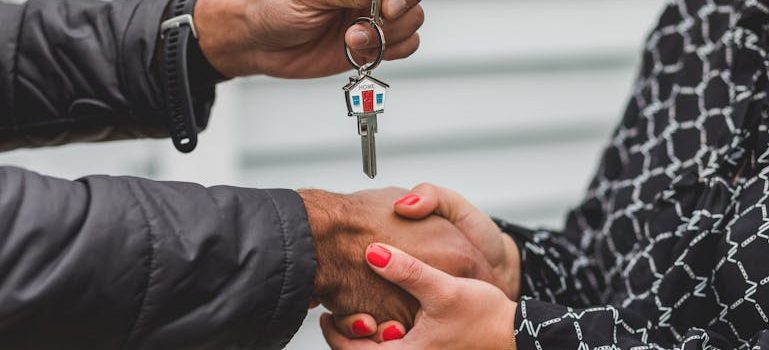 Person Holding Silver Key