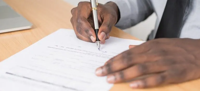 person signing a contract