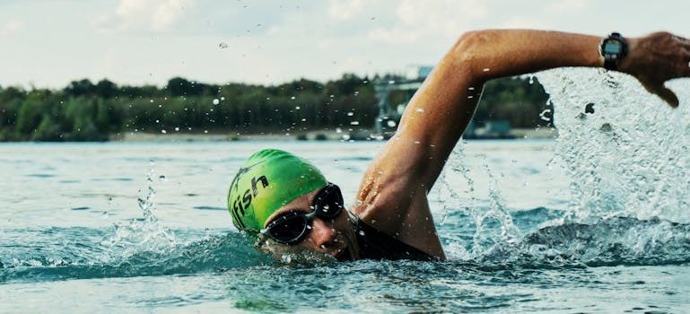Person Swimming on Body of Water