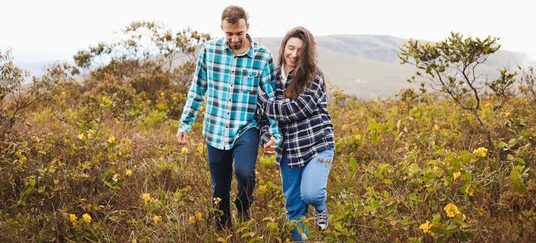 Couple Enjoying Nature Walk in Open Field