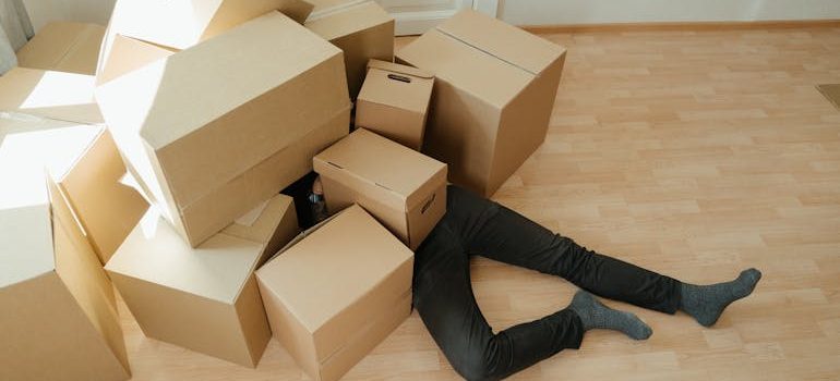 Brown Cardboard Boxes on Brown Wooden Floor