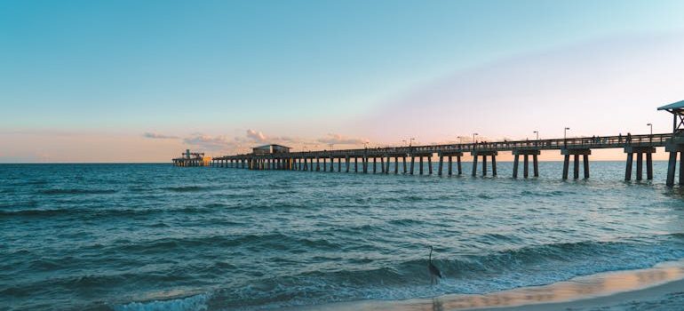 Scenic Pier at Sunset Overlooking Calm Ocean Waves