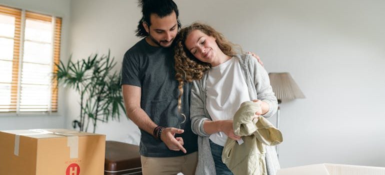a couple talking about Why hiring a moving company is worth every penny