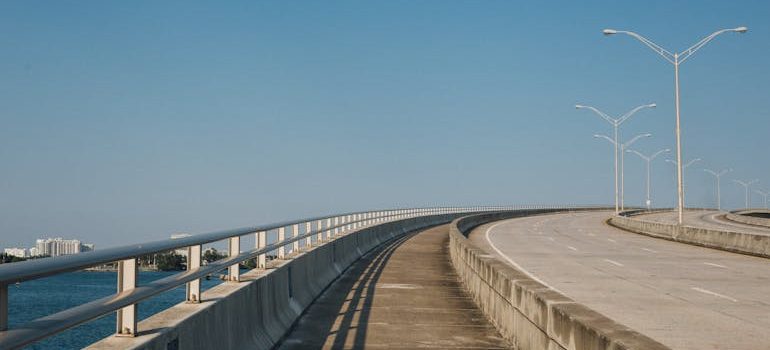 Gray Bridge Near Body of Water
