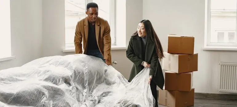 Man and Woman Unpacking in New Home