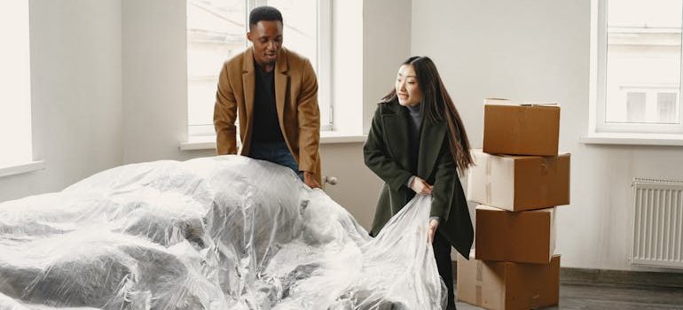 Man and Woman Unpacking in New Home