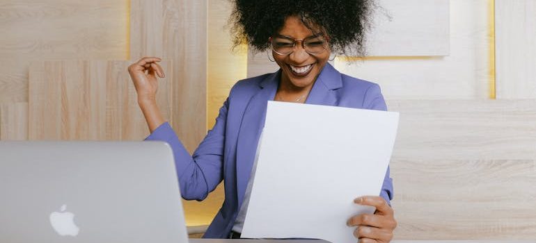 Woman Holding A Paper
