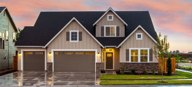 Brown and Gray Painted House in Front of Road