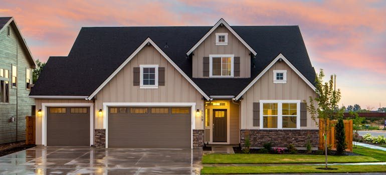 Brown and Gray Painted House in Front of Road